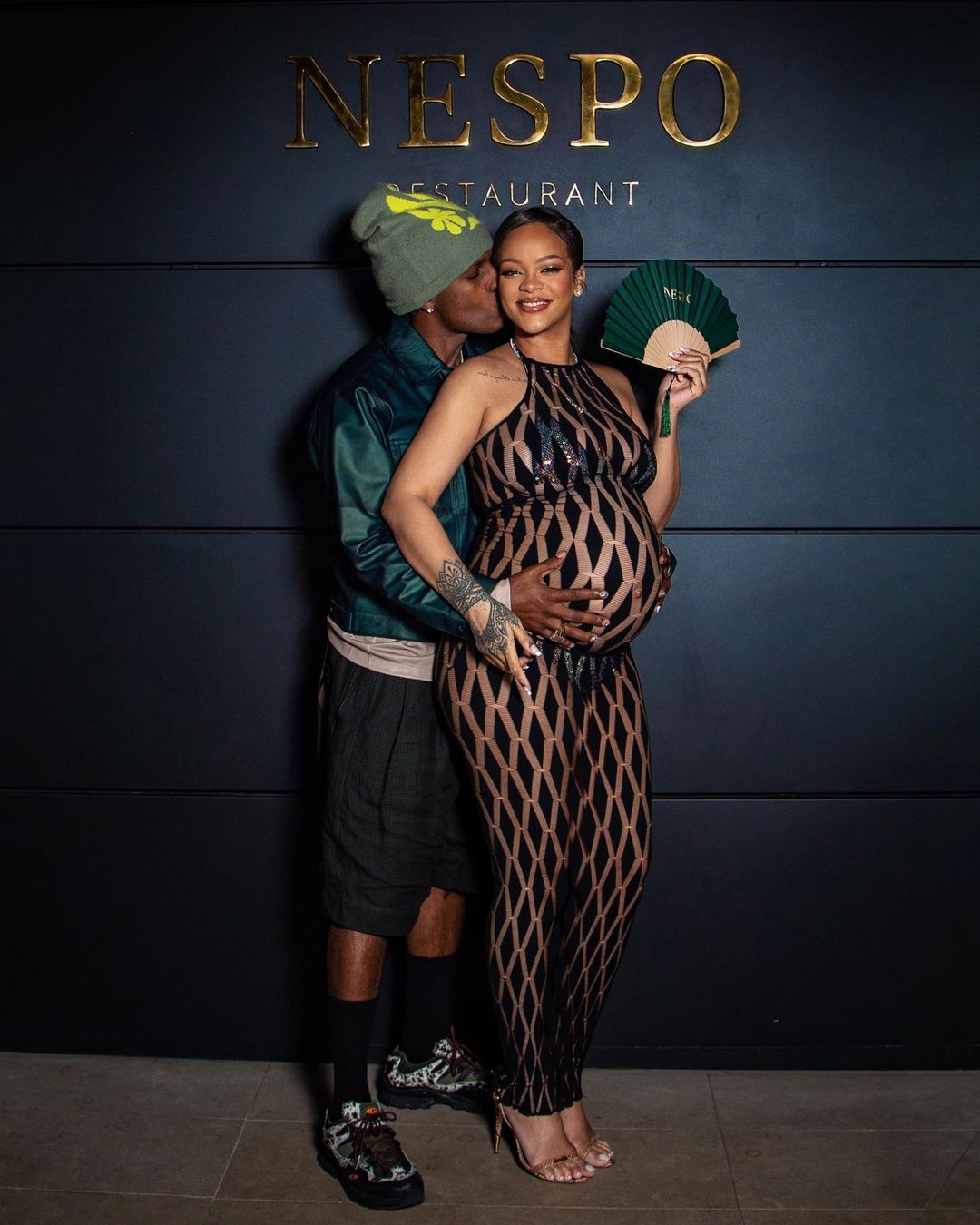 Rihanna Flexes Baby Bump at Pharrell's Louis Vuitton Debut Show