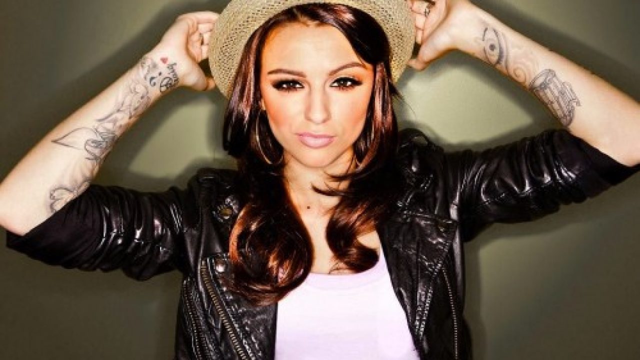 Cher incorporated the bird, peace sign, and question mark tattoos into a  partial sleeve in May 2011, when … | Cher lloyd tattoos, Girls with sleeve  tattoos, Tattoos