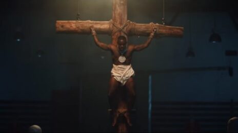 Watch:  DaBaby Shocks With Crucifixion Scene in 'Tough Skin' Music Video