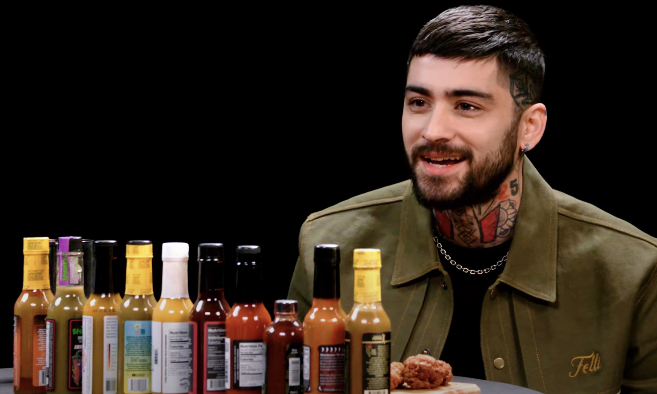 Watch: Zayn Heats Up on Hot Ones, Dishes on New Album ‘Room Under the Stairs’