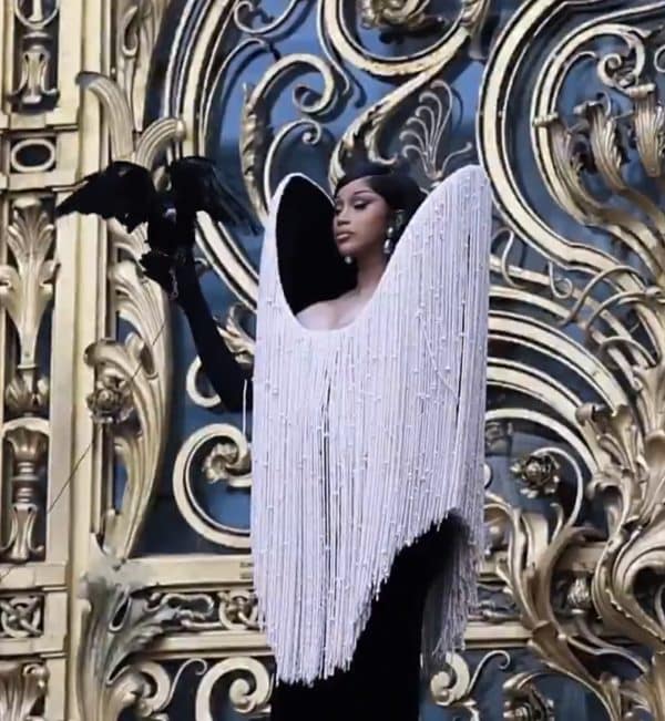 Cardi B Brings the Drama & Storms Paris Fashion Week with a Crow