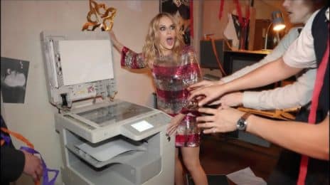 Stream: Kylie Minogue Unveils 'Office Party' Video / Drops 10th Anniversary Edition of 'Kylie Christmas (Fully Wrapped)'